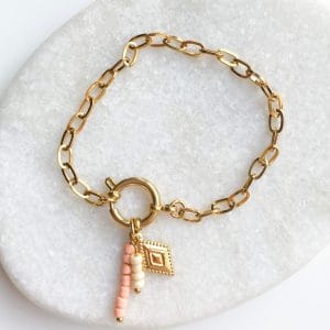 Schakelarmband party ruitje goud/zalm